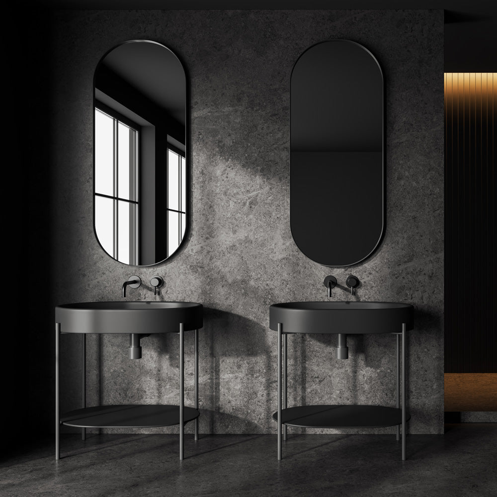 Freestanding white sink on matte black metal console